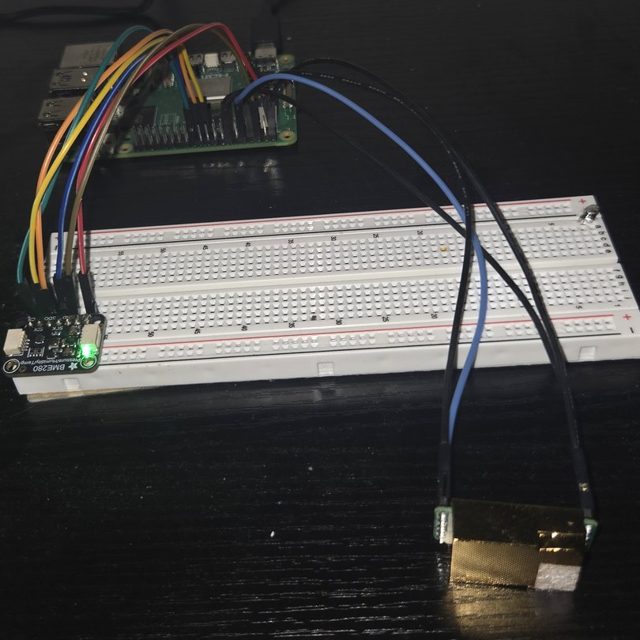 Raspberry Pi 5 wired to a BME280 sensor on a breadboard and an MH-Z19 CO₂ sensor